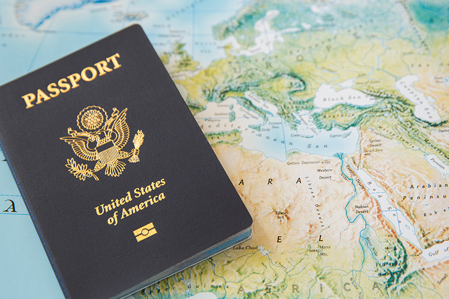 A US Passport laying on a map